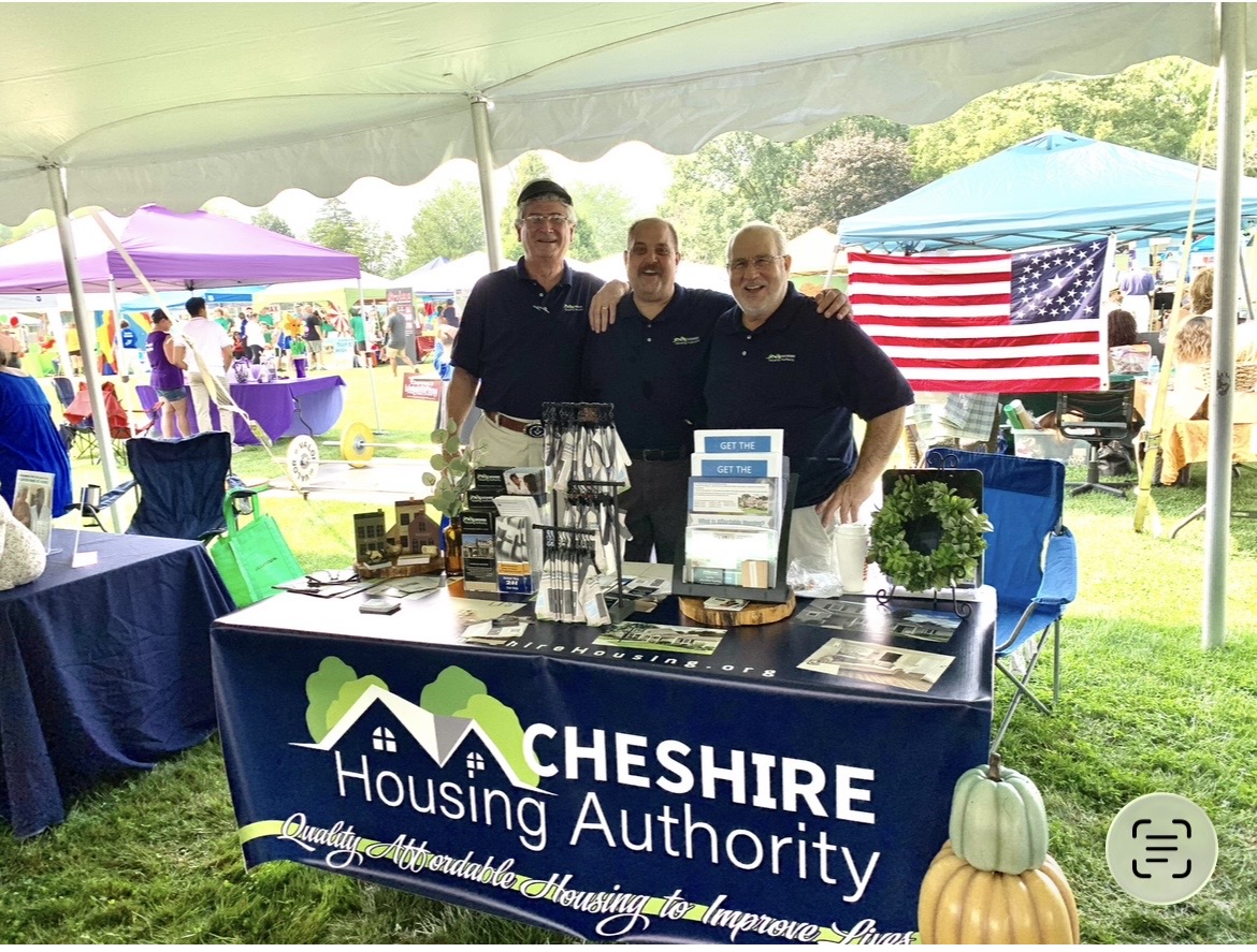 Cheshire Housing Authority team at a community event booth